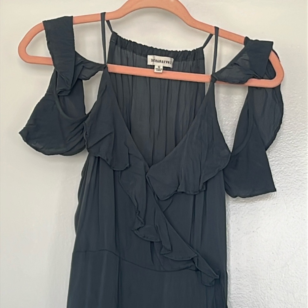 Teal colored flowy dress.
